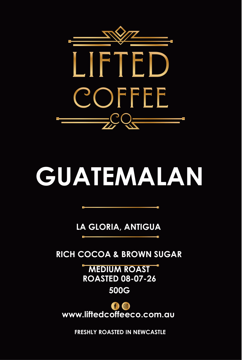 A flat product label or packaging design for Lifted Coffee Guatemalan, featuring a black background with gold and white text detailing the coffee origin, roast, and flavor notes.