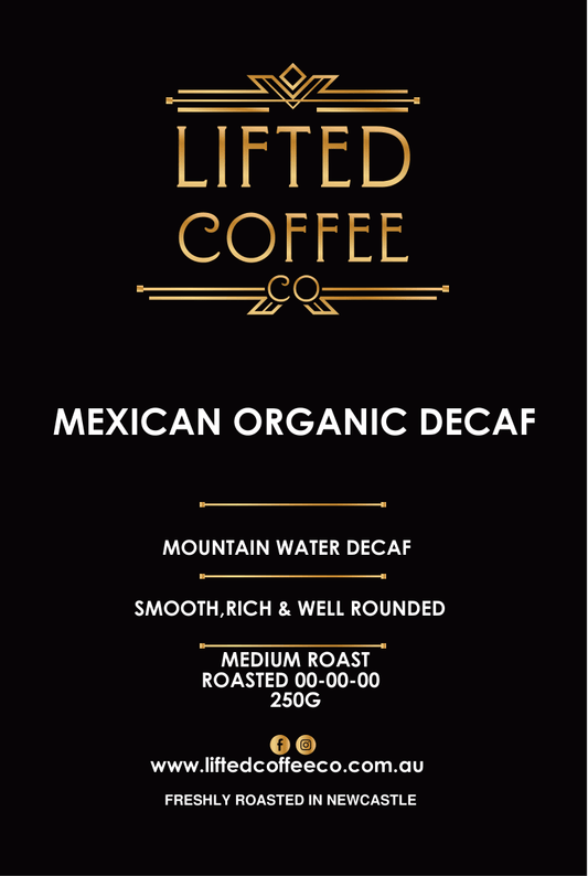 Lifted Coffee Co. Mexican Organic Decaf coffee package with branding and product details on a black background.