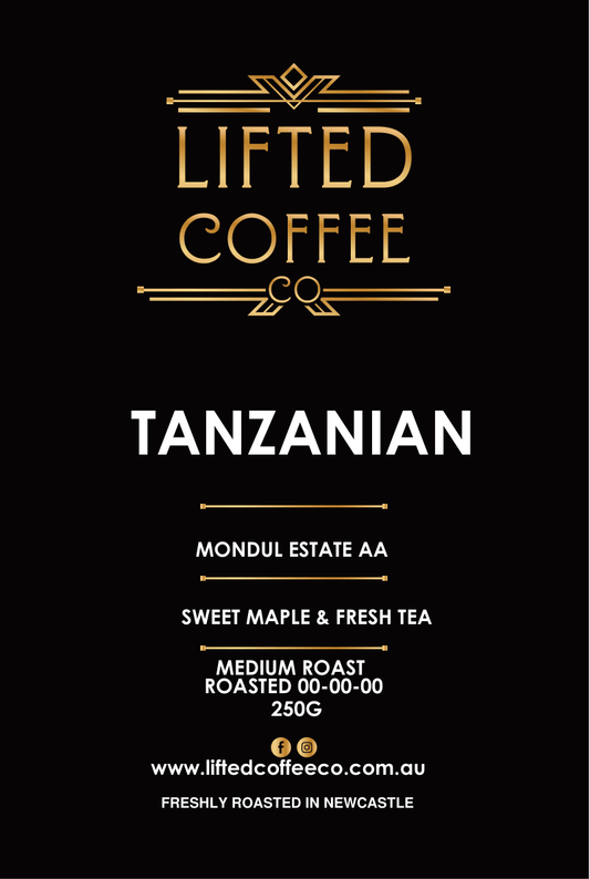 Lifted Coffee Co. Tanzania coffee package with branding and roast details on a black background